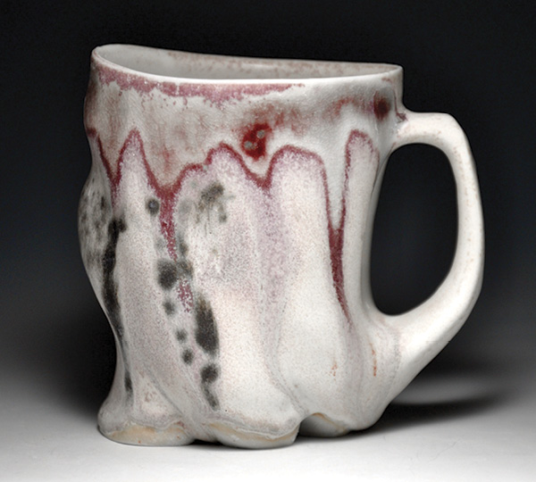 Altered mug, Coleman Porcelain, fired in reduction to cone 10, 2024.