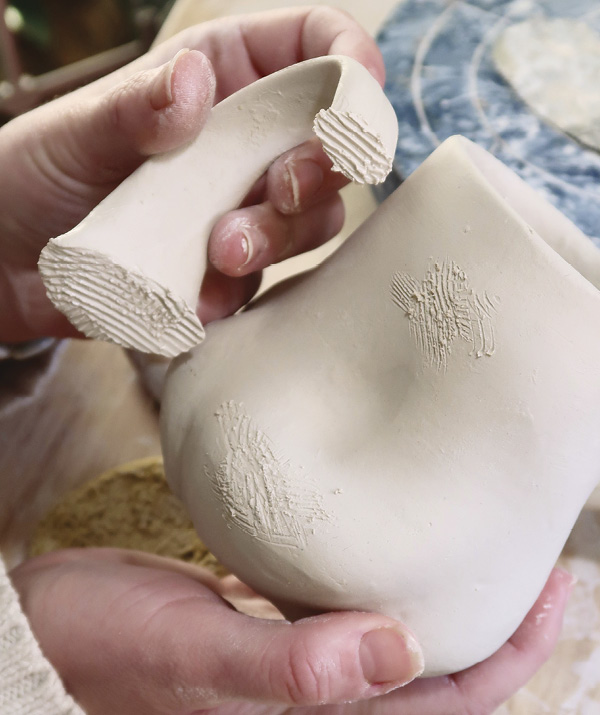 10 Score the mug and both connecting points of the handle.