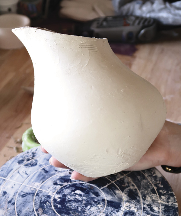 17 Use the same technique as the mug to belly out one side of the pitcher where the handle will go.