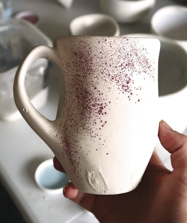 18 Once the piece is glazed with a liner and base glaze, sprinkle cobalt oxide to produce specks of blue.