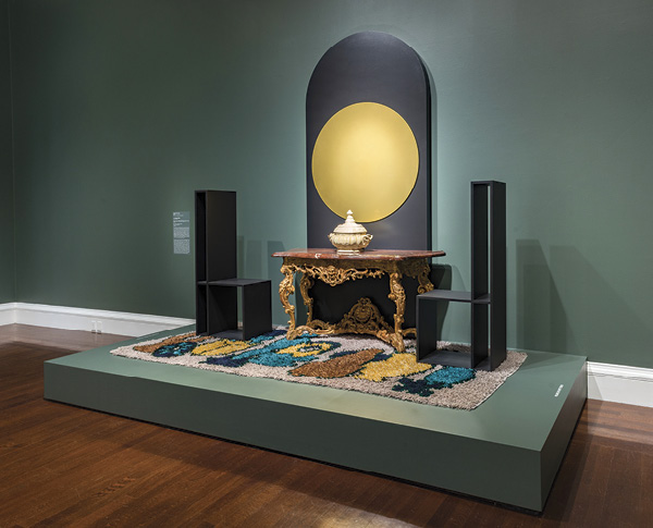 2 High Rise Farrago, 10 ft. (3 m) in height, porcelain, fired to cone 8 in an electric kiln, powder-coated aluminum, wood, hand-knotted wool rug, circa 1715–1720 console table (collection of Cincinnati Art Museum), 2021. Photo: Rob Deslongchamps for the Cincinnati Art Museum.