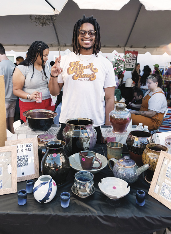 8 Teacher and member Tay Baker at the Holiday Market. Photo: Casey James.