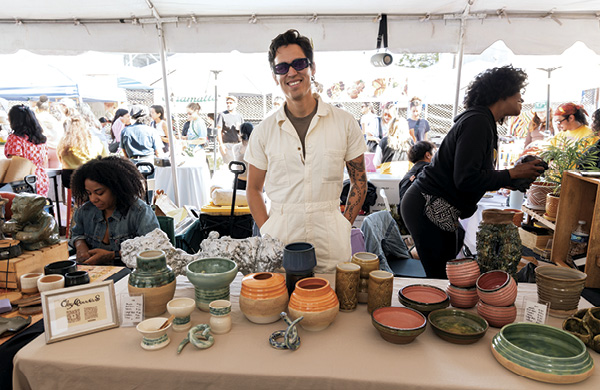 11 Teacher and member Aram Hernandez at the Holiday Market. Photo: Casey James.