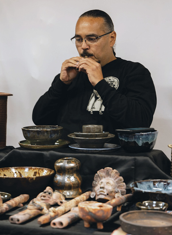 12 Ceramic artist (and our manager Ollin’s father) Gabriel Gonzalez at the Holiday Market. Photo: Casey James.